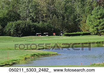 Stock Photo - glistening, carts, 
game, course, 
competition, golf, 
apr. fotosearch 
- search stock 
photos, pictures, 
images, and photo 
clipart