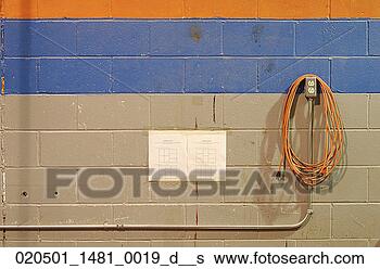 Stock Photo - extension cord, 
warehouse, sign, 
conduit, workplace, 
electricity, wall. 
fotosearch - search 
stock photos, 
pictures, images, 
and photo clipart