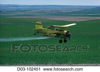 Stock Photography - crop duster spraying 
fields alberta 
canada. fotosearch 
- search stock 
photos, pictures, 
images, and photo 
clipart
