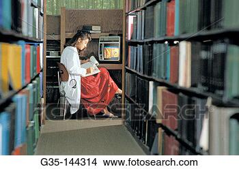 Stock Photo - medicine student 
in library. fotosearch 
- search stock 
photos, pictures, 
images, and photo 
clipart
