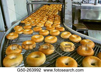 Stock Photo - bagels on production 
line. fotosearch 
- search stock 
photos, pictures, 
images, and photo 
clipart