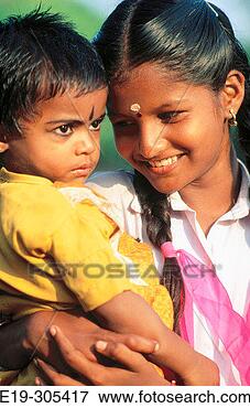 Picture - girl and baby 
in kerala, india. 
fotosearch - search 
stock photos, 
pictures, images, 
and photo clipart
