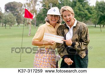 Stock Photograph - golfing women 
showing their 
score cards. fotosearch 
- search stock 
photos, pictures, 
images, and photo 
clipart