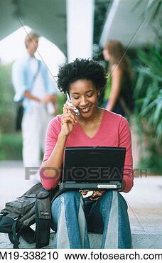 Stock Photography - student with laptop 
and cellular. 
fotosearch - search 
stock photos, 
pictures, images, 
and photo clipart