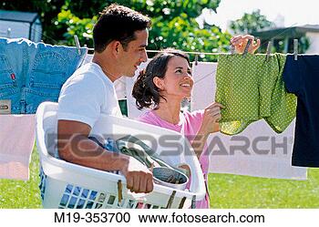 Stock Photography - couple drying 
clothes. fotosearch 
- search stock 
photos, pictures, 
images, and photo 
clipart