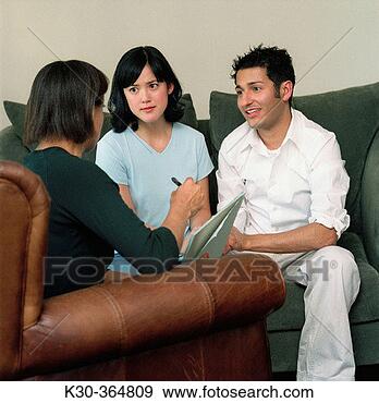 Stock Photograph - man and woman 
in counseling 
session. fotosearch 
- search stock 
photos, pictures, 
images, and photo 
clipart