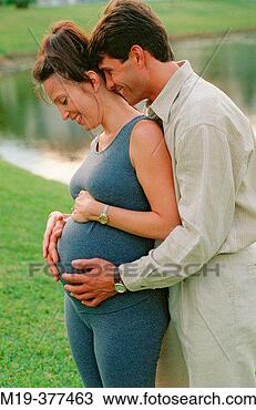 Stock Photo - pregnant woman 
with affectionate 
husband. fotosearch 
- search stock 
photos, pictures, 
images, and photo 
clipart