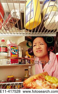 Stock Photo - college girl in 
curlers looks 
in the refrigerator. 
fotosearch - search 
stock photos, 
pictures, images, 
and photo clipart