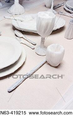 Stock Image - dinner service 
wrapped in white 
linen. fotosearch 
- search stock 
photos, pictures, 
images, and photo 
clipart