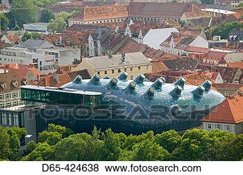 Stock Photo - kunsthaus graz 
new art museum 
view from schlossberg 
architects: peter. 
fotosearch - search 
stock photos, 
pictures, images, 
and photo clipart