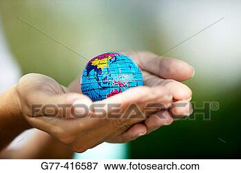 Picture - woman hands holding 
small world globe. 
fotosearch - search 
stock photos, 
pictures, images, 
and photo clipart