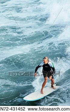Stock Photo - senior surfing 
baja california 
mexico. fotosearch 
- search stock 
photos, pictures, 
images, and photo 
clipart