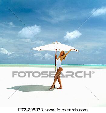 Stock Photo - bathing suit, 
bathing suits, 
beach, beaches, 
chill out, chilling 
out. fotosearch 
- search stock 
photos, pictures, 
images, and photo 
clipart