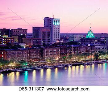 Picture - city skyline at 
sunset from hutchinson 
island savannah 
georgia, usa. 
fotosearch - search 
stock photos, 
pictures, images, 
and photo clipart