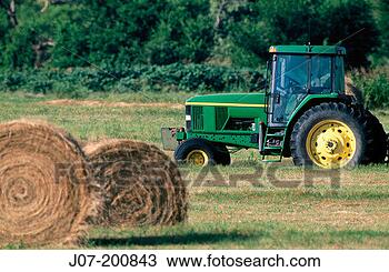 Stock Photo - farm tractor and 
round hay bales 
texas usa. fotosearch 
- search stock 
photos, pictures, 
images, and photo 
clipart