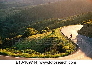 Stock Photo - women jogging 
afternoon road. 
fotosearch - search 
stock photos, 
pictures, images, 
and photo clipart