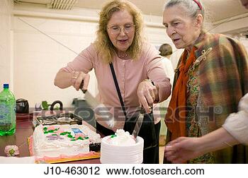 Stock Photo - birthday age 90, 
 alzheimer´s patient, 
 with care-giver 
at church. fotosearch 
- search stock 
photos, pictures, 
images, and photo 
clipart