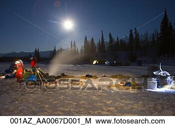 Stock Photo - teams rest under 
the moonlight 
at the finger 
lake checkpoint 
on. fotosearch 
- search stock 
photos, pictures, 
images, and photo 
clipart