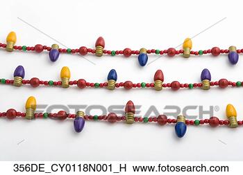 Stock Photo - closeup of four 
strings of colorful 
wooden christmas 
tree light beads. 
fotosearch - search 
stock photos, 
pictures, images, 
and photo clipart