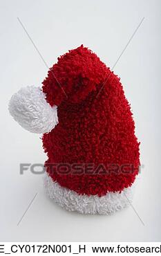 Stock Photo - closeup of small 
santa claus hat 
with tassel outstretched 
on white. fotosearch 
- search stock 
photos, pictures, 
images, and photo 
clipart