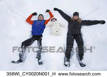 Stock Photo - family portrait 
of two parents 
and one infant 
bundled up for 
winter. fotosearch 
- search stock 
photos, pictures, 
images, and photo 
clipart