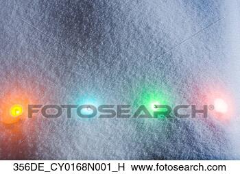 Stock Photo - one strand of 
multi-colored 
christmas tree 
lights shining 
through. fotosearch 
- search stock 
photos, pictures, 
images, and photo 
clipart