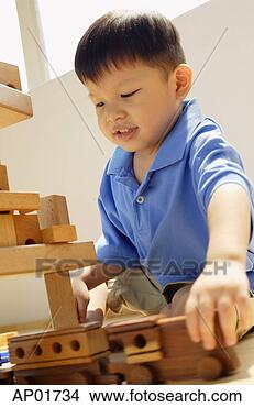 Stock Photo - boy playing with 
toy train. fotosearch 
- search stock 
photos, pictures, 
images, and photo 
clipart