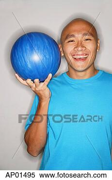 Stock Image - man holding bowling 
ball, smiling. 
fotosearch - search 
stock photos, 
pictures, images, 
and photo clipart