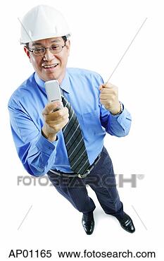 Stock Image - man wearing hardhat 
looking at mobile 
phone, making 
a fist. fotosearch 
- search stock 
photos, pictures, 
images, and photo 
clipart