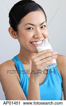 Stock Photography - woman drinking 
glass of milk. 
fotosearch - search 
stock photos, 
pictures, images, 
and photo clipart