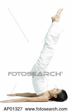 Picture - woman lying on 
floor, raising 
legs in air. fotosearch 
- search stock 
photos, pictures, 
images, and photo 
clipart