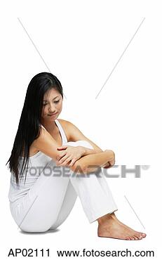 Stock Photography - woman sitting 
on floor, hugging 
knees, looking 
down. fotosearch 
- search stock 
photos, pictures, 
images, and photo 
clipart