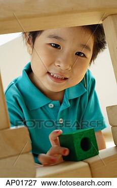 Picture - young girl with 
building blocks, 
looking at camera. 
fotosearch - search 
stock photos, 
pictures, images, 
and photo clipart