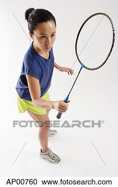 Stock Photography - woman holding 
badminton racket, 
high angle view. 
fotosearch - search 
stock photos, 
pictures, images, 
and photo clipart