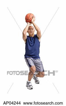 Stock Photo - young man holding 
basketball, aiming. 
fotosearch - search 
stock photos, 
pictures, images, 
and photo clipart