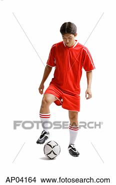 Stock Photo - young man in soccer 
uniform with soccer 
ball. fotosearch 
- search stock 
photos, pictures, 
images, and photo 
clipart