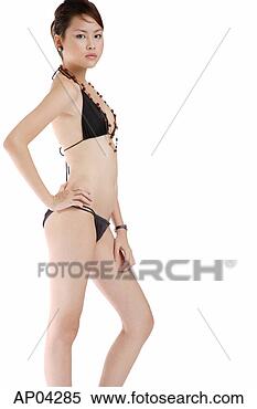 Stock Image - young woman in 
brown bikini, 
standing against 
white background. 
fotosearch - search 
stock photos, 
pictures, images, 
and photo clipart