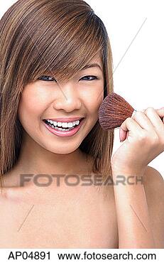 Stock Photography - teenage girl holding 
make-up brush 
to face. fotosearch 
- search stock 
photos, pictures, 
images, and photo 
clipart