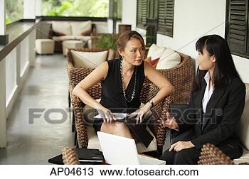 Stock Photo - two businesswomen 
sitting on patio 
having a discussion. 
fotosearch - search 
stock photos, 
pictures, images, 
and photo clipart