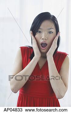 Stock Photo - woman with hands 
on either side 
of face, mouth 
open. fotosearch 
- search stock 
photos, pictures, 
images, and photo 
clipart
