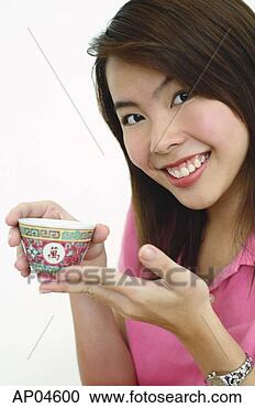 Stock Photography - woman holding 
chinese tea cup. 
fotosearch - search 
stock photos, 
pictures, images, 
and photo clipart