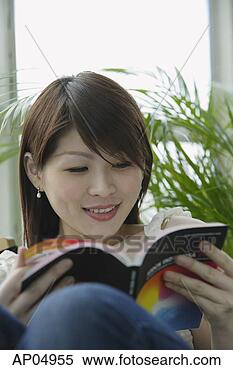 Stock Image - young woman reading 
a book. fotosearch 
- search stock 
photos, pictures, 
images, and photo 
clipart