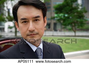 Stock Photography - businessman looking 
at camera, portrait. 
fotosearch - search 
stock photos, 
pictures, images, 
and photo clipart