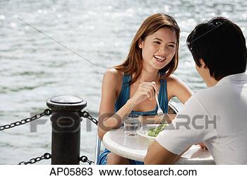 Stock Photo - couple sitting 
at outdoor cafe, 
having lunch. 
fotosearch - search 
stock photos, 
pictures, images, 
and photo clipart
