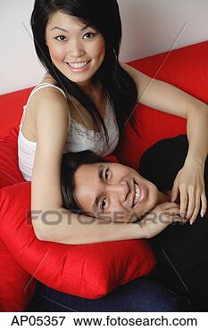 Picture - couple smiling 
at camera, man 
lying on woman's 
lap. fotosearch 
- search stock 
photos, pictures, 
images, and photo 
clipart