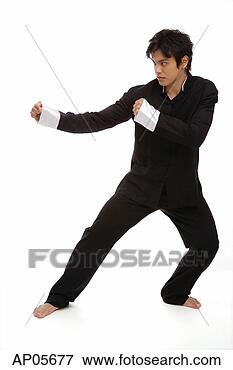 Picture - young man practicing 
kong fu. fotosearch 
- search stock 
photos, pictures, 
images, and photo 
clipart