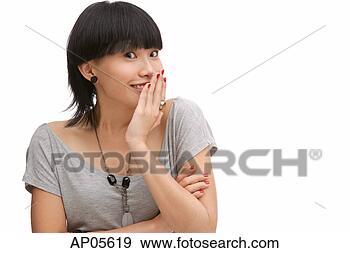 Stock Photograph - young woman with 
hand on mouth, 
looking at camera. 
fotosearch - search 
stock photos, 
pictures, images, 
and photo clipart