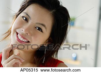 Stock Image - young woman smiling, 
head shot. fotosearch 
- search stock 
photos, pictures, 
images, and photo 
clipart