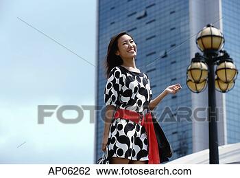 Stock Photo - woman carrying 
shopping bags. 
fotosearch - search 
stock photos, 
pictures, images, 
and photo clipart
