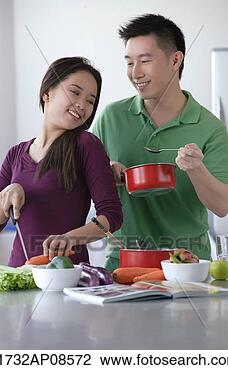 Stock Photo - couple cooking 
together. fotosearch 
- search stock 
photos, pictures, 
images, and photo 
clipart